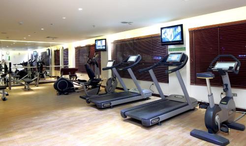 a gym with treadmills and exercise bikes in a room at Holiday Inn Al Khobar by IHG in Al Khobar