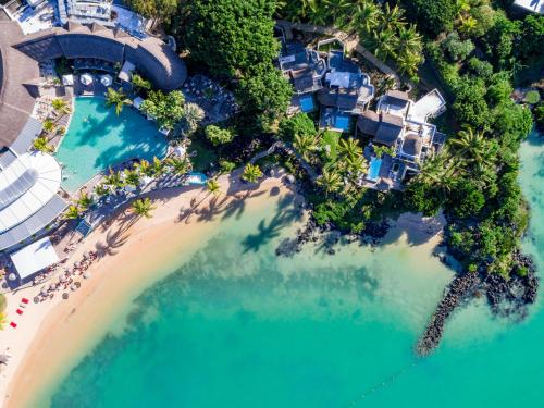 an aerial view of a resort with a beach at LUX* Grand Gaube Resort & Villas in Grand Gaube