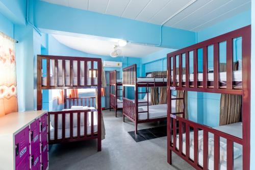 Postel nebo postele na pokoji v ubytování Hatyai Dee Hostel