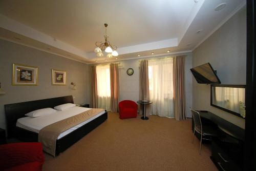 מיטה או מיטות בחדר ב-Belogorye Hotel