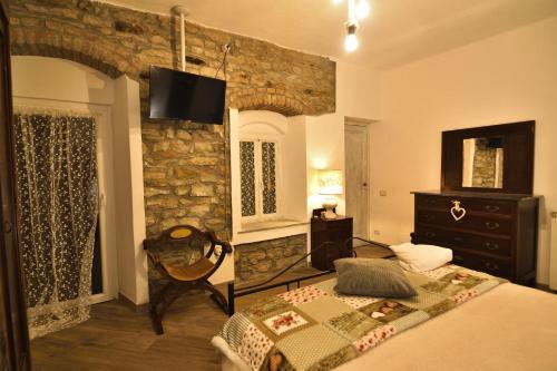 Postel nebo postele na pokoji v ubytování Il Borgo del Castello