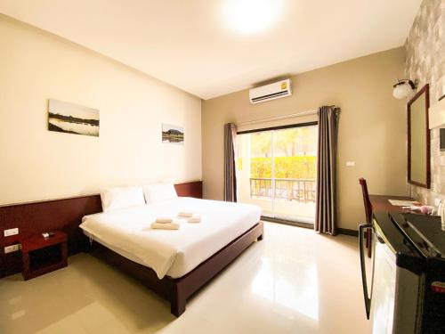 En eller flere senge i et værelse på Bestiny Hotel & Restaurant Phetchabun