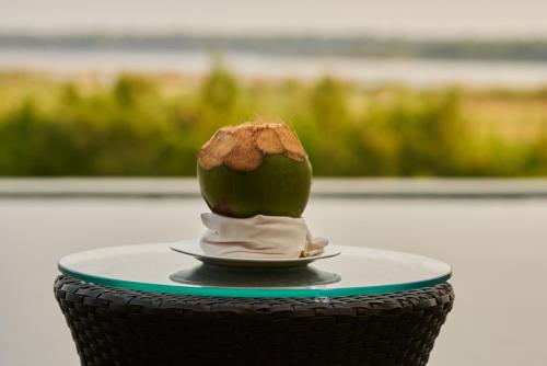 a piece of food on a plate on a table at Sterling Palavelli Godavari in Rāzole