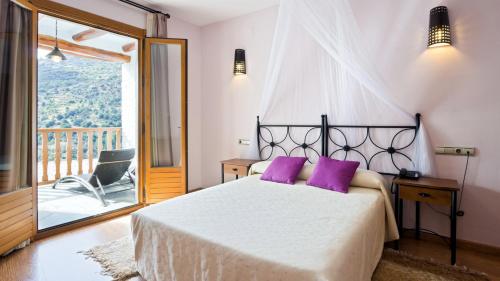 En eller flere senge i et værelse på Estrella de las Nieves