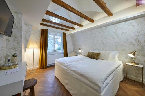 Postel nebo postele na pokoji v ubytování BUITERLING Hotel