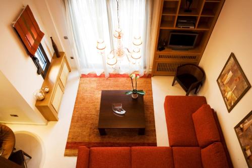 an overhead view of a living room with a couch and a table at Melon Suites in Thessaloniki