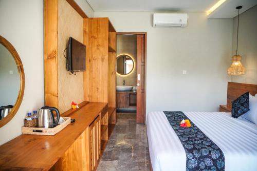 Cama o camas de una habitación en Bisma Terrace Suite Ubud
