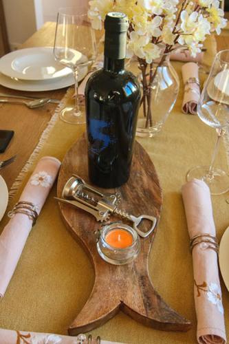 a bottle of wine sitting on top of a table at Villa Natasha in Makarska