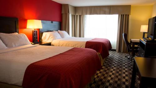 a hotel room with two beds and a window at Holiday Inn Saint Louis-Fairview Heights by IHG in Fairview Heights