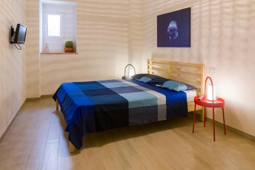 Postel nebo postele na pokoji v ubytování LA NASSA SUITES & ROOMS