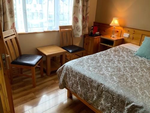 Ein Bett oder Betten in einem Zimmer der Unterkunft Algret House B&B