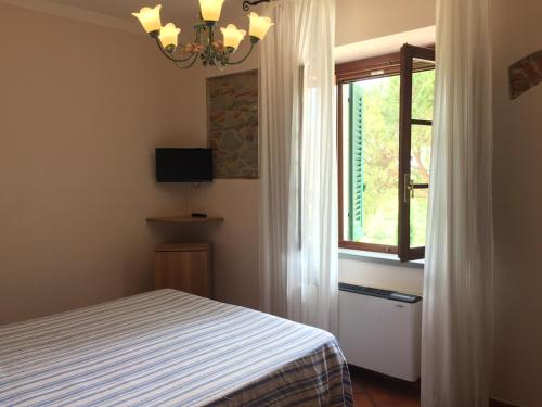 Katil atau katil-katil dalam bilik di Agriturismo Isola Verde