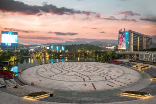 a large labyrinth in the middle of a city at night at Junluxe Hotel Guangzhou Science City-Free Shuttle Bus Service to Guangzhou Canton Fair in Guangzhou
