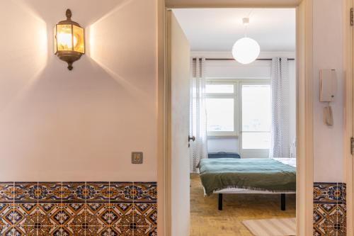 מיטה או מיטות בחדר ב-Wine Inn Carcavelos Guesthouse