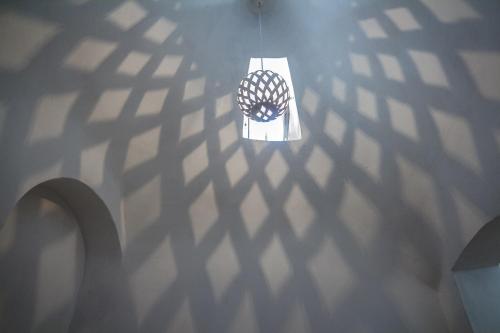 an overhead view of a ceiling with a light fixture at Trulli-eu Guesthouse Alberobello in Alberobello