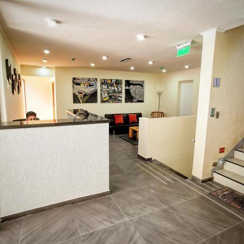 an office with a reception counter and a lobby at Apart Hotel Viva Providencia in Santiago