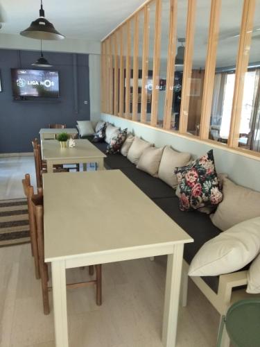 a living room with a couch and a table at King Alexander in Florina