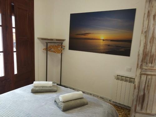 a bedroom with a bed with two pillows on it at Casa Mineta in Cretas