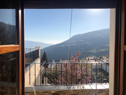 a balcony with a view of a mountain at Hostal Rural Poqueira in Capileira