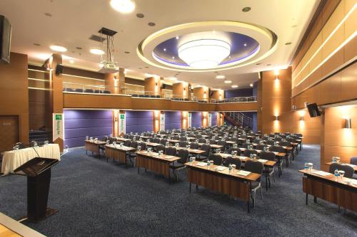 a large room filled with tables and chairs at Holiday Inn Ankara-Kavaklidere, an IHG Hotel in Ankara