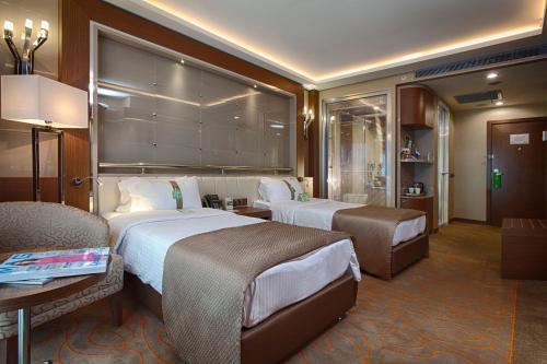 A bed or beds in a room at Holiday Inn Ankara-Kavaklidere by IHG