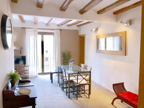 a living room with a dining room table and chairs at Top Barcelona Apartments in Barcelona