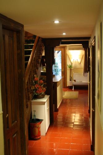 a hallway of a house with a staircase and a room at Hostería La Antigua in Potes