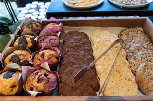 a box of different types of muffins and pastries at L'Andana Tenuta La Badiola in Castiglione della Pescaia