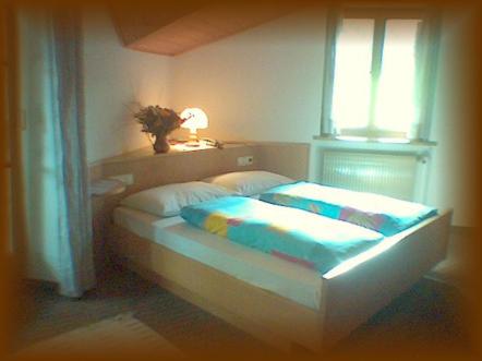 Llit o llits en una habitació de Gasthof zum Schlern
