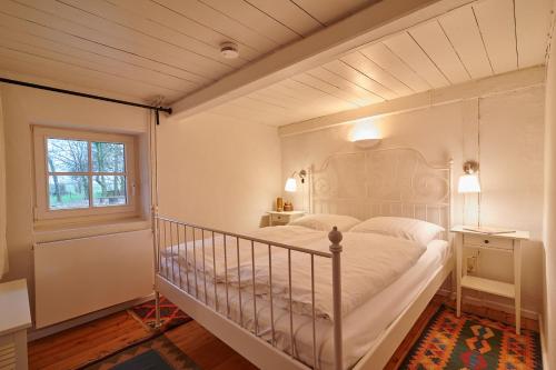 En eller flere senge i et værelse på Landfein Haus Fedderingen