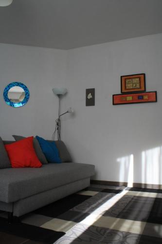 a living room with a couch and a rug at TataBlu residenza con parcheggio in Florence