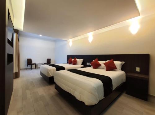 Krevet ili kreveti u jedinici u objektu Hotel La Estancia Zacatlan