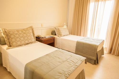 Cama ou camas em um quarto em Jurerê Beach Village
