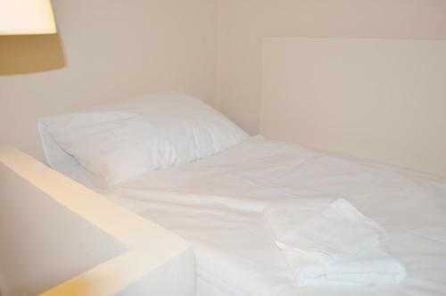 Säng eller sängar i ett rum på Synagogue View Guest House