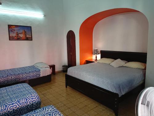 a bedroom with two beds and an arched ceiling at Suite Vintage in Puebla