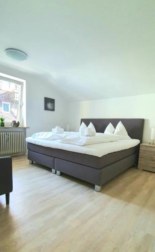 a bedroom with a large bed in a room at Sanosueno in Sonthofen