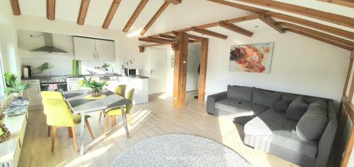 a living room with a couch and a table at Sanosueno in Sonthofen