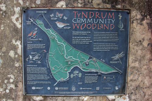 a sign is attached to a wall at Trekker Hut in Tyndrum