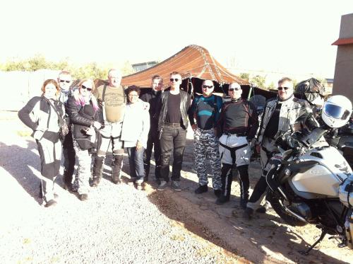 a group of people posing for a picture next to a motorcycle at Ferme D"Hote Lala Fatima in Aïn Leuh