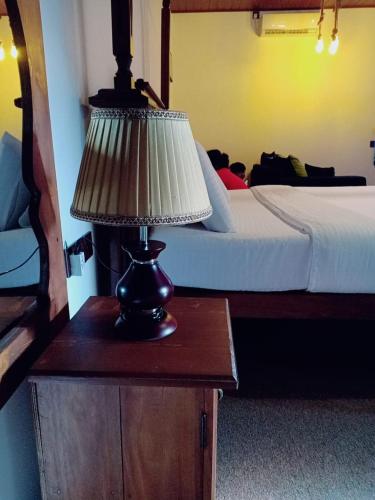 Ένα ή περισσότερα κρεβάτια σε δωμάτιο στο Cozy Homestay