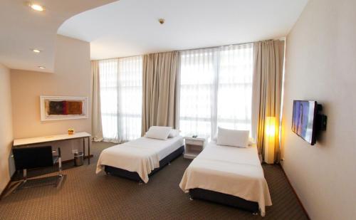 Postel nebo postele na pokoji v ubytování Hotel Guarani Asuncion