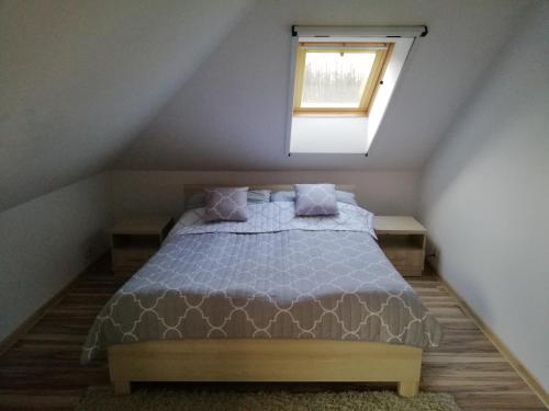 a bedroom with a bed in a attic at Willa Kisajno in Giżycko