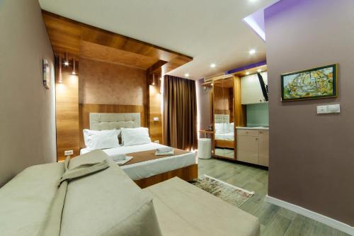Ένα ή περισσότερα κρεβάτια σε δωμάτιο στο Etna Apartments