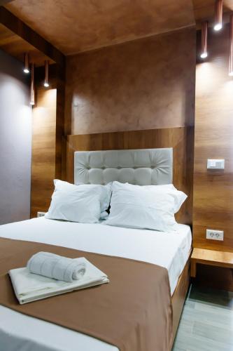 Ένα ή περισσότερα κρεβάτια σε δωμάτιο στο Etna Apartments