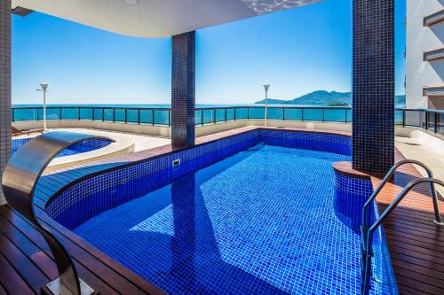 a swimming pool on the roof of a building at Hotel D'sintra in Balneário Camboriú