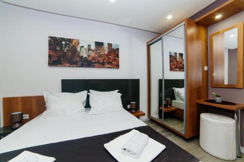Ένα ή περισσότερα κρεβάτια σε δωμάτιο στο Etna Apartments