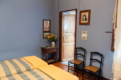 Ένα ή περισσότερα κρεβάτια σε δωμάτιο στο Casa Sastre Segui