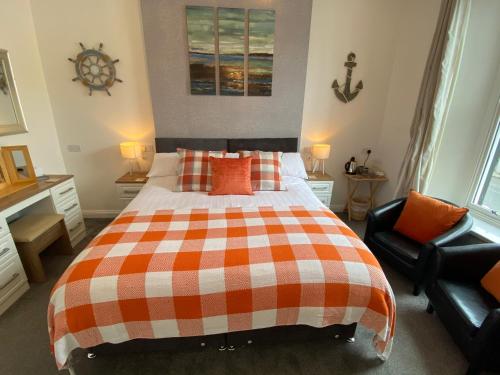 Ένα ή περισσότερα κρεβάτια σε δωμάτιο στο Coach Guest House