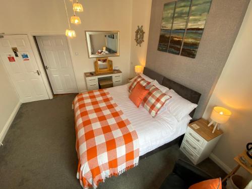 Ένα ή περισσότερα κρεβάτια σε δωμάτιο στο Coach Guest House