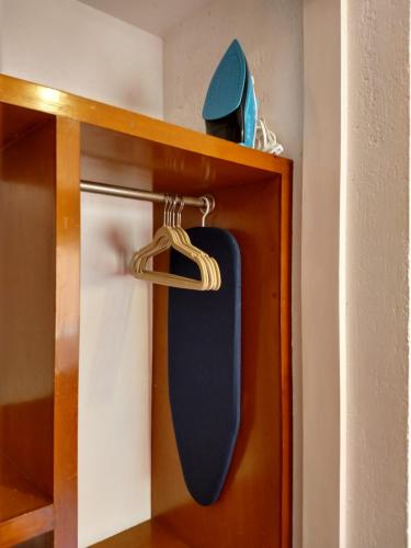 a skateboard is hanging from aabinet at Residence Las Trojes Cdmx in Mexico City